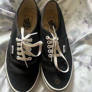 Vans Black and White Canvas Shoes has stain on left sneaker